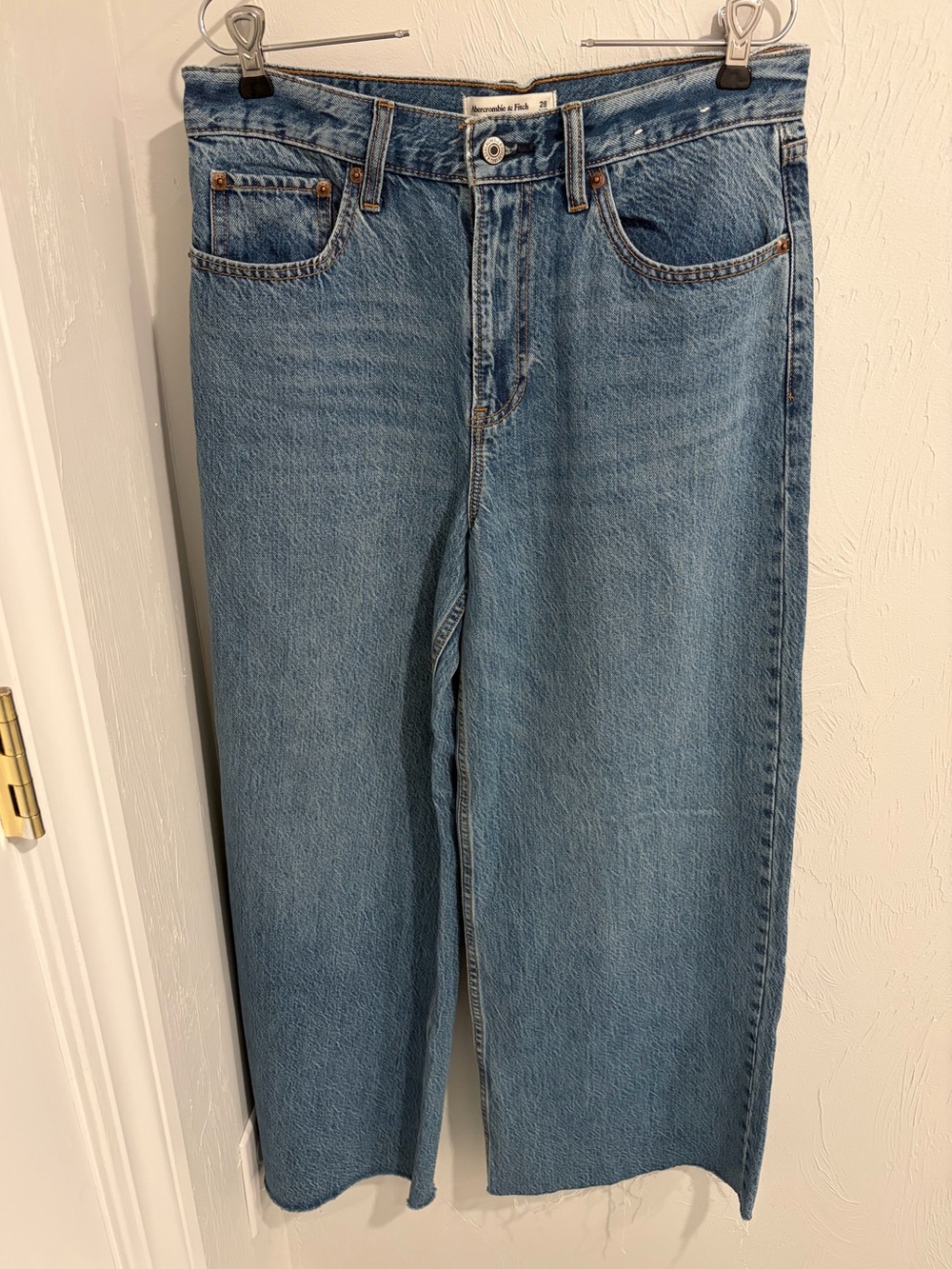 A&F High Rise Wide Leg Jean size 28 Short 
Medium with raw hem. Never worn!